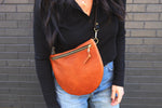 the sling, pebbled cognac (black strap, black zipper)