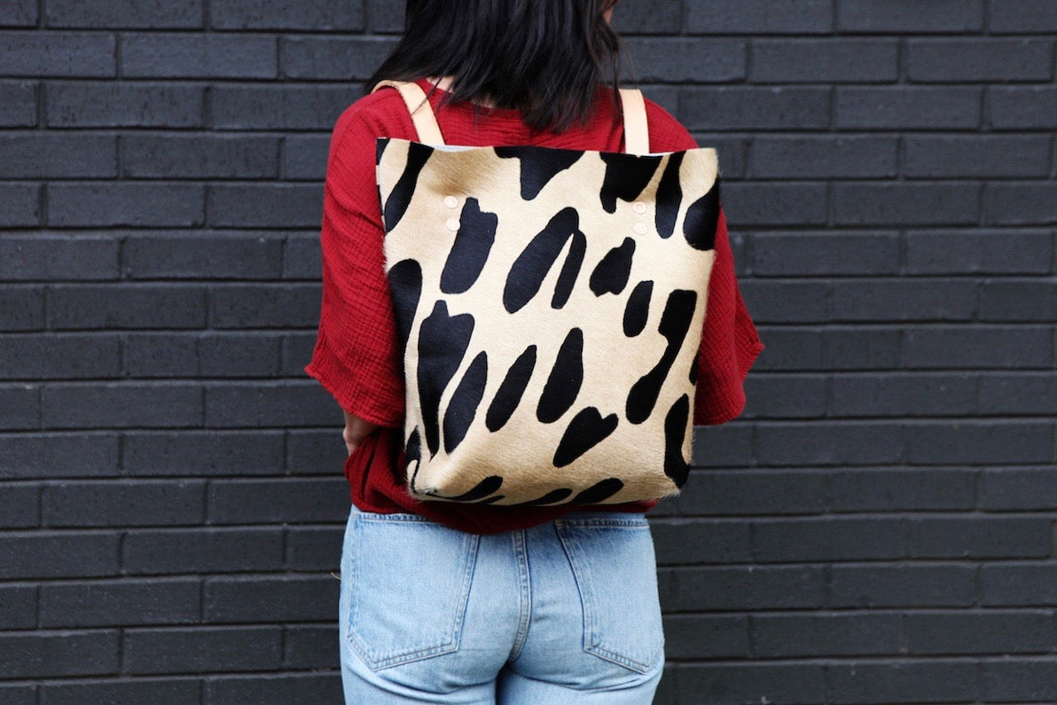 the walkabout, oversized leopard black + tan hide