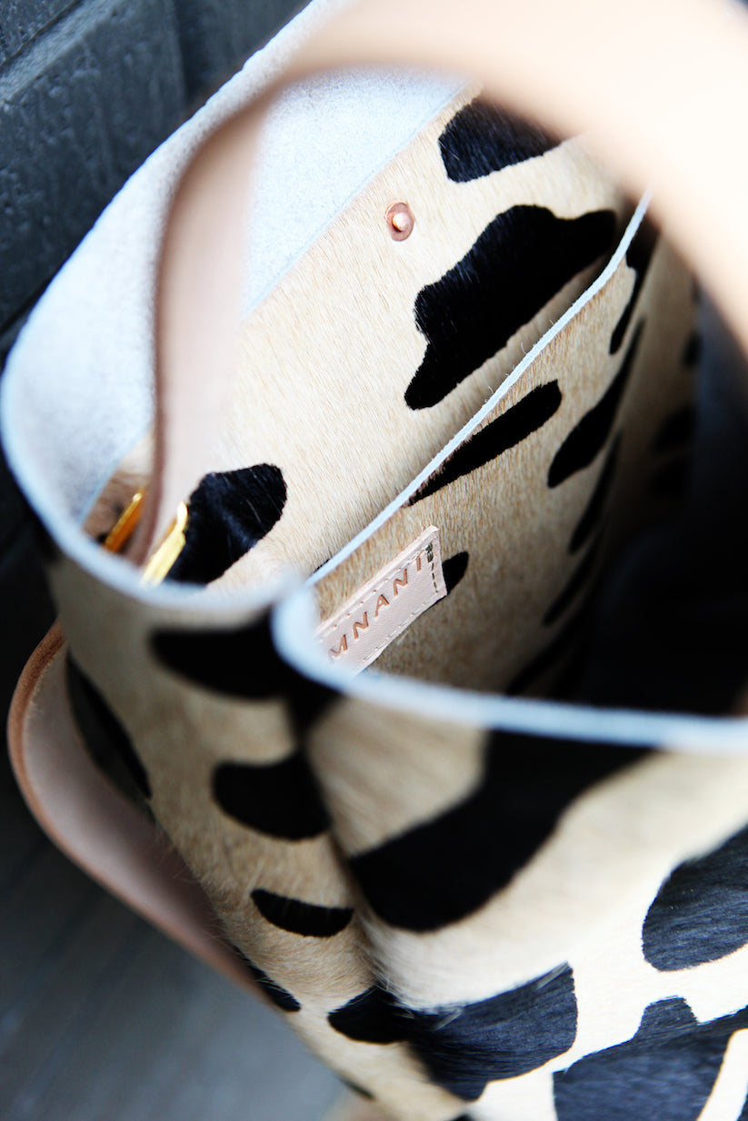 the walkabout, oversized leopard black + tan hide